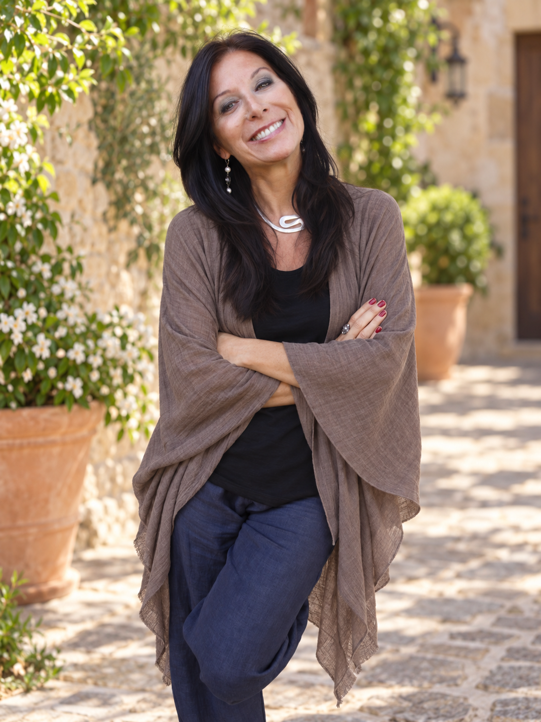 Renee Blodgett standing in a garden courtyard
